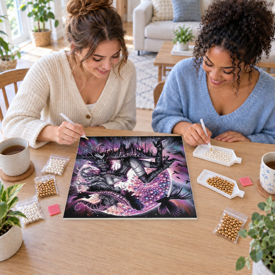 Two friends creating one shared Pearl artwork — Silver-Haired Witch with Ravens. Pearl diamond painting DIY kit by Isuvio.