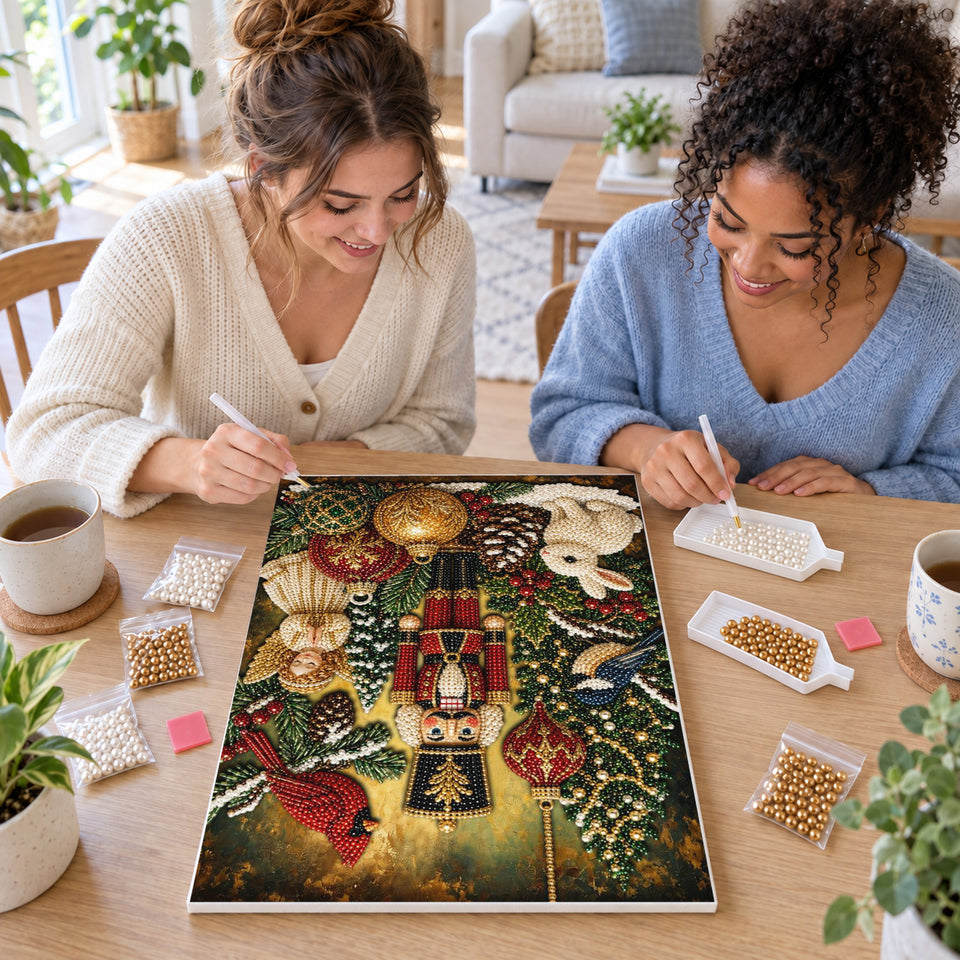 Two friends creating one shared Pearl artwork — Christmas Nutcracker with a Cardinal and Rabbit. Pearl diamond painting DIY kit by Isuvio.