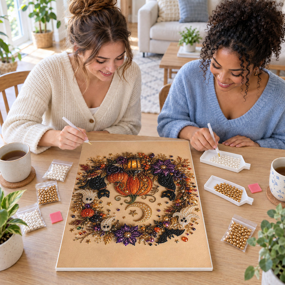Two friends creating one shared Pearl artwork — Pumpkin Moon Halloween Wreath. Pearl diamond painting DIY kit by Isuvio.