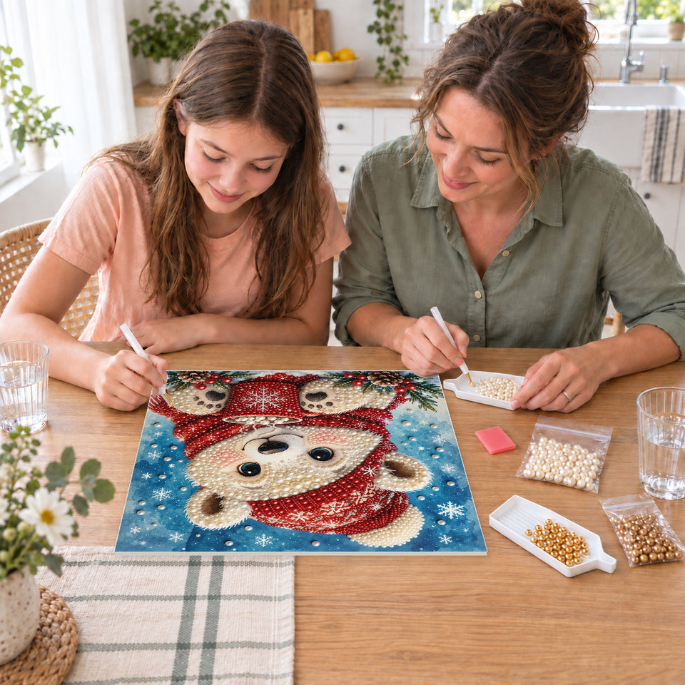 Mother and daughter creating one shared Pearl artwork — Polar Bear Cub with a Red Cocoa Mug. Pearl diamond painting DIY kit by Isuvio.