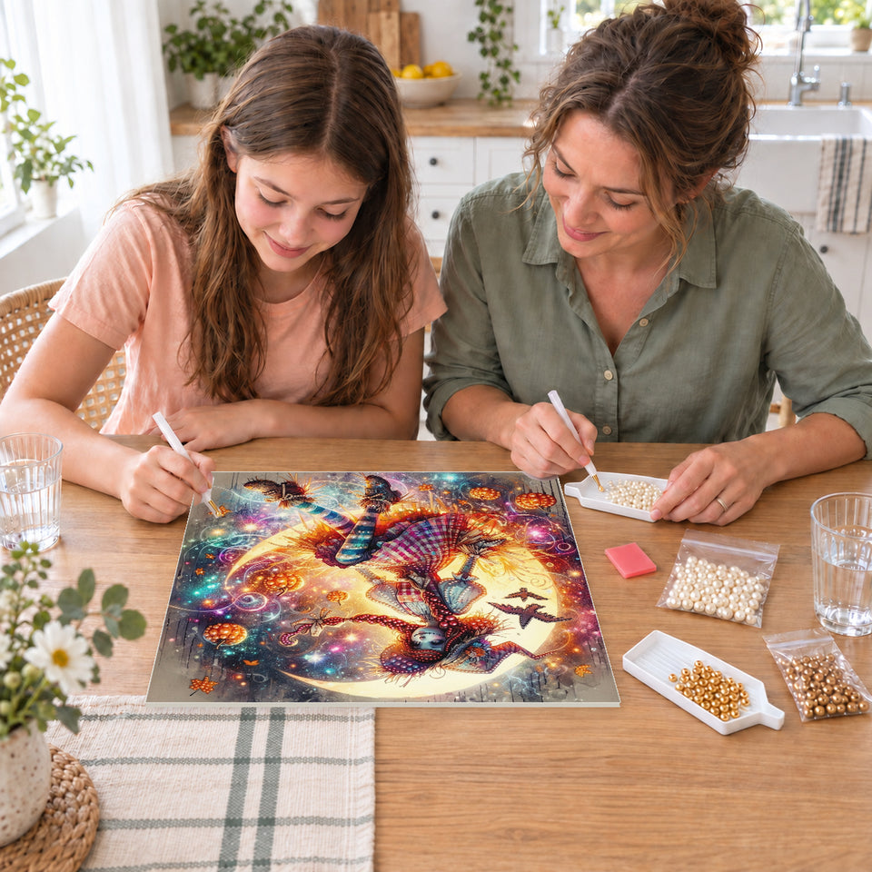 Mother and daughter creating one shared Pearl artwork — Patchwork Witch on a Glowing Crescent Moon. Pearl diamond painting DIY kit by Isuvio.