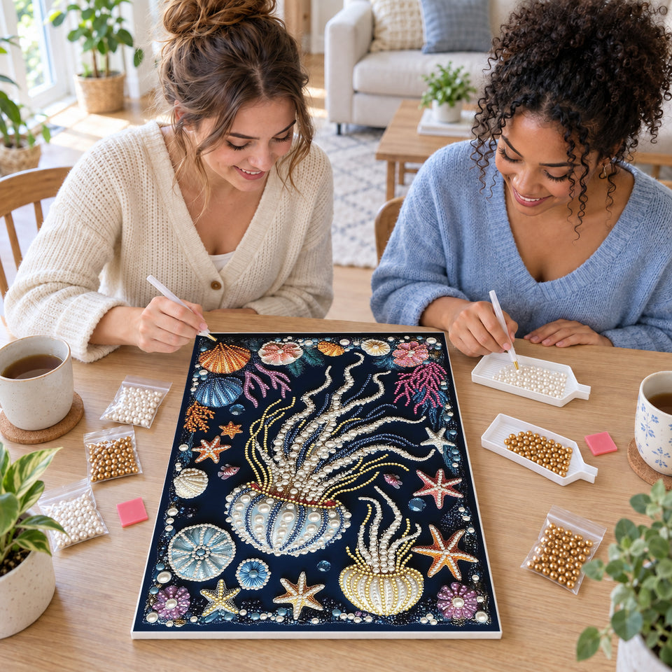 Two friends creating one shared Pearl artwork — Pearl Jellyfish with Colorful Coral and Seashells. Pearl diamond painting DIY kit by Isuvio.