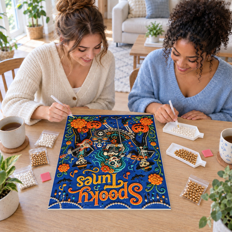 Two friends creating one shared Pearl artwork — Spooky Tunes Skeleton Musicians. Pearl diamond painting DIY kit by Isuvio.