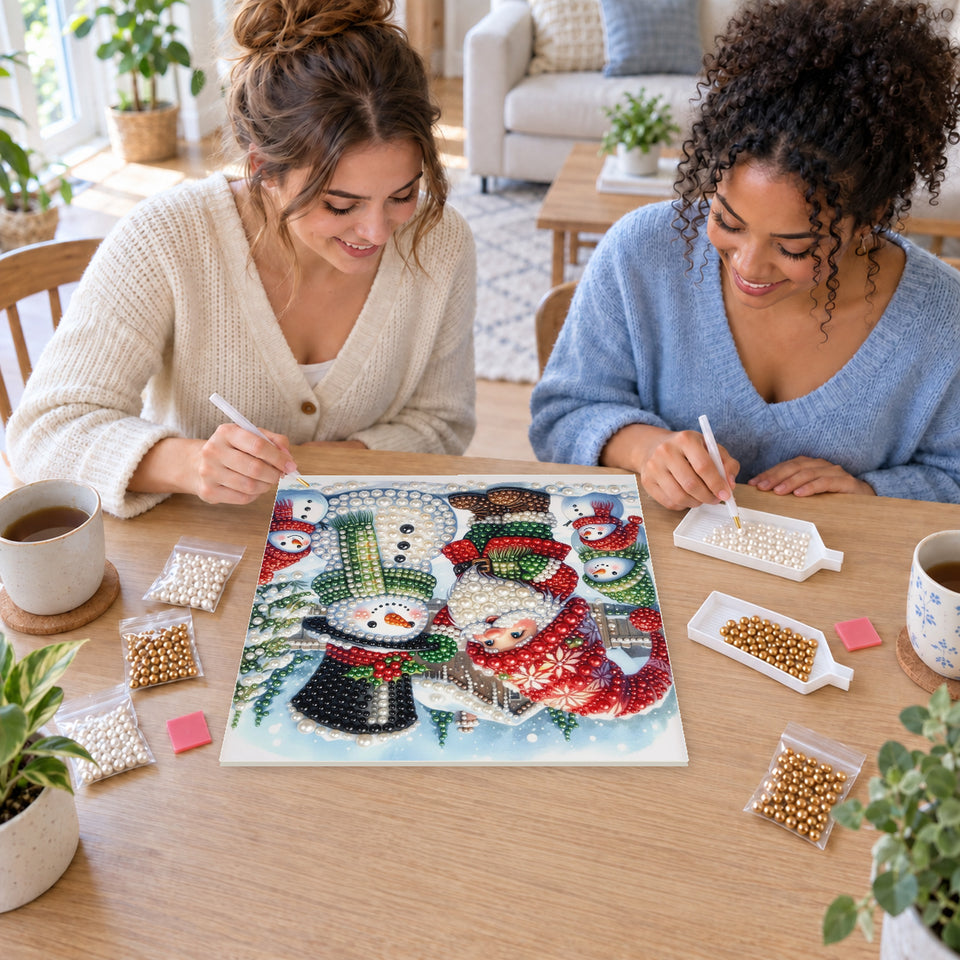Two friends creating one shared Pearl artwork — Christmas Gnome and Snowman Friends. Pearl diamond painting DIY kit by Isuvio.