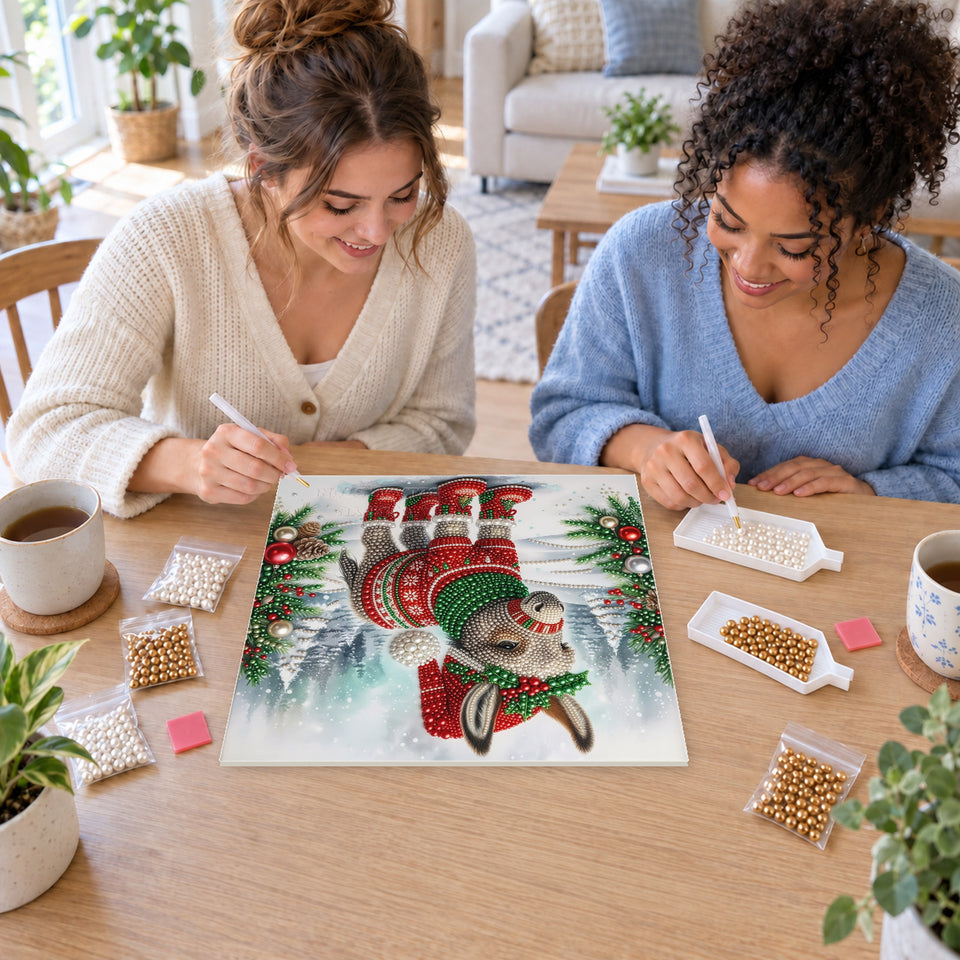 Two friends creating one shared Pearl artwork — Christmas Donkey in a Nordic Sweater. Pearl diamond painting DIY kit by Isuvio.