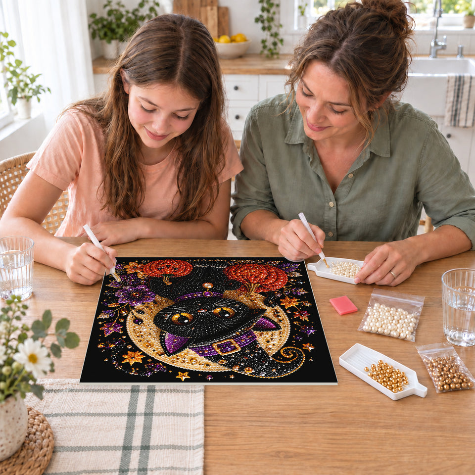 Mother and daughter creating one shared Pearl artwork — Black Witch Kitten beneath a Golden Moon. Pearl diamond painting DIY kit by Isuvio.