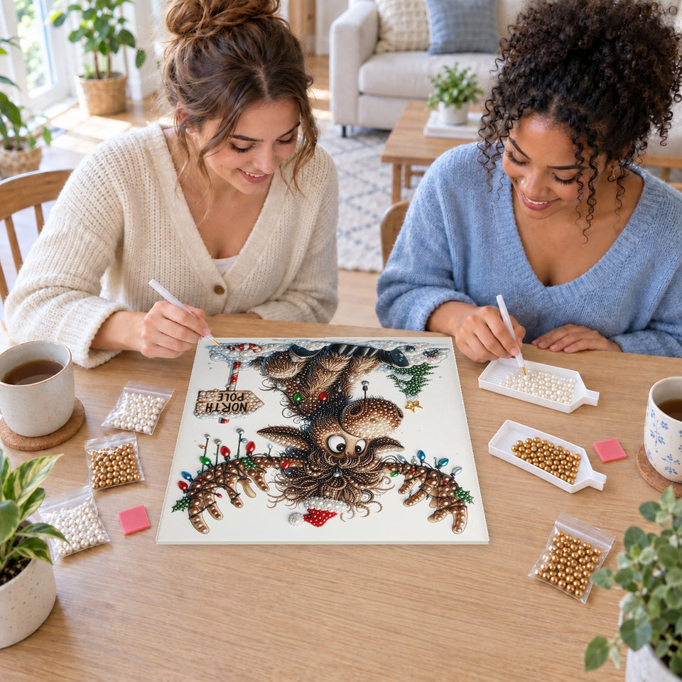 Two friends creating one shared Pearl artwork — Christmas Moose at the North Pole. Pearl diamond painting DIY kit by Isuvio.