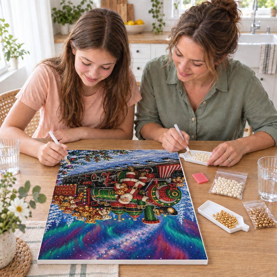 Mother and daughter creating one shared Pearl artwork — Santa Express Beneath the Northern Lights. Pearl diamond painting DIY kit by Isuvio.