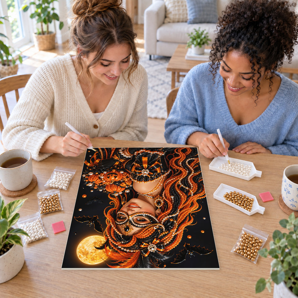 Two friends creating one shared Pearl artwork — Autumn Masquerade with a Pumpkin Bouquet. Pearl diamond painting DIY kit by Isuvio.