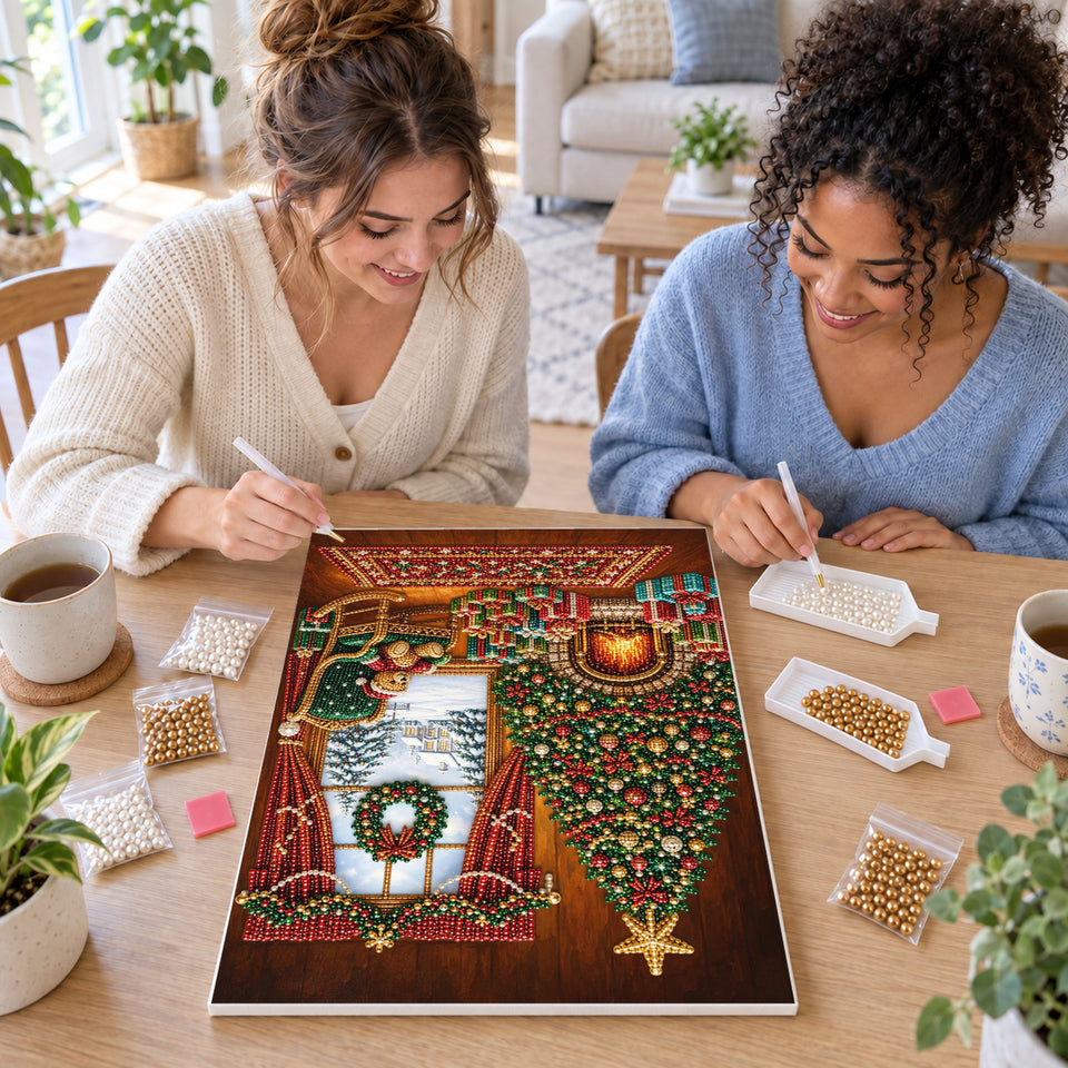 Two friends creating one shared Pearl artwork — Cozy Christmas Tree Living Room. Pearl diamond painting DIY kit by Isuvio.