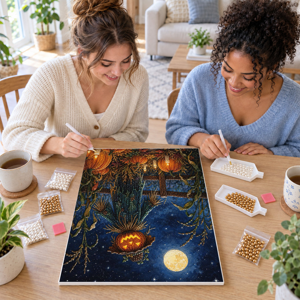 Two friends creating one shared Pearl artwork — Pumpkin Scarecrow Beneath a Full Moon. Pearl diamond painting DIY kit by Isuvio.