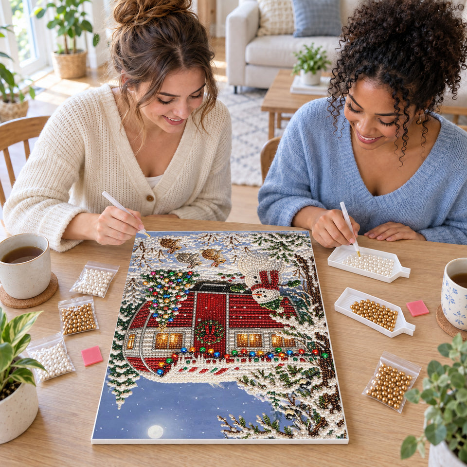 Two friends creating one shared Pearl artwork — Red Christmas Camper and Snowman. Pearl diamond painting DIY kit by Isuvio.
