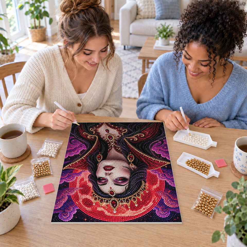 Two friends creating one shared Pearl artwork — Gothic Queen Beneath a Crimson Moon. Pearl diamond painting DIY kit by Isuvio.