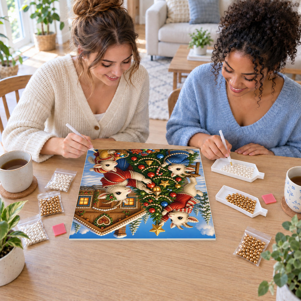 Two friends creating one shared Pearl artwork — Christmas Goats Decorating a Chalet Tree. Pearl diamond painting DIY kit by Isuvio.