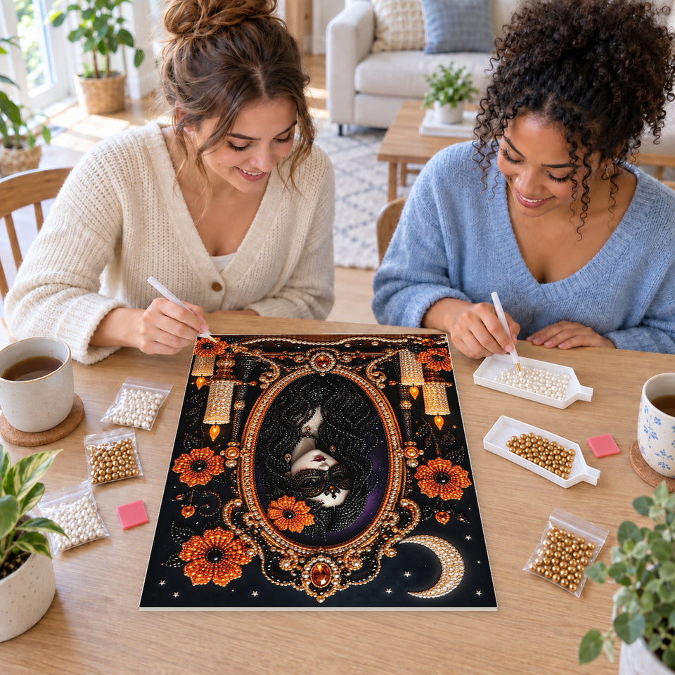 Two friends creating one shared Pearl artwork — Masked Enchantress in an Ornate Mirror. Pearl diamond painting DIY kit by Isuvio.