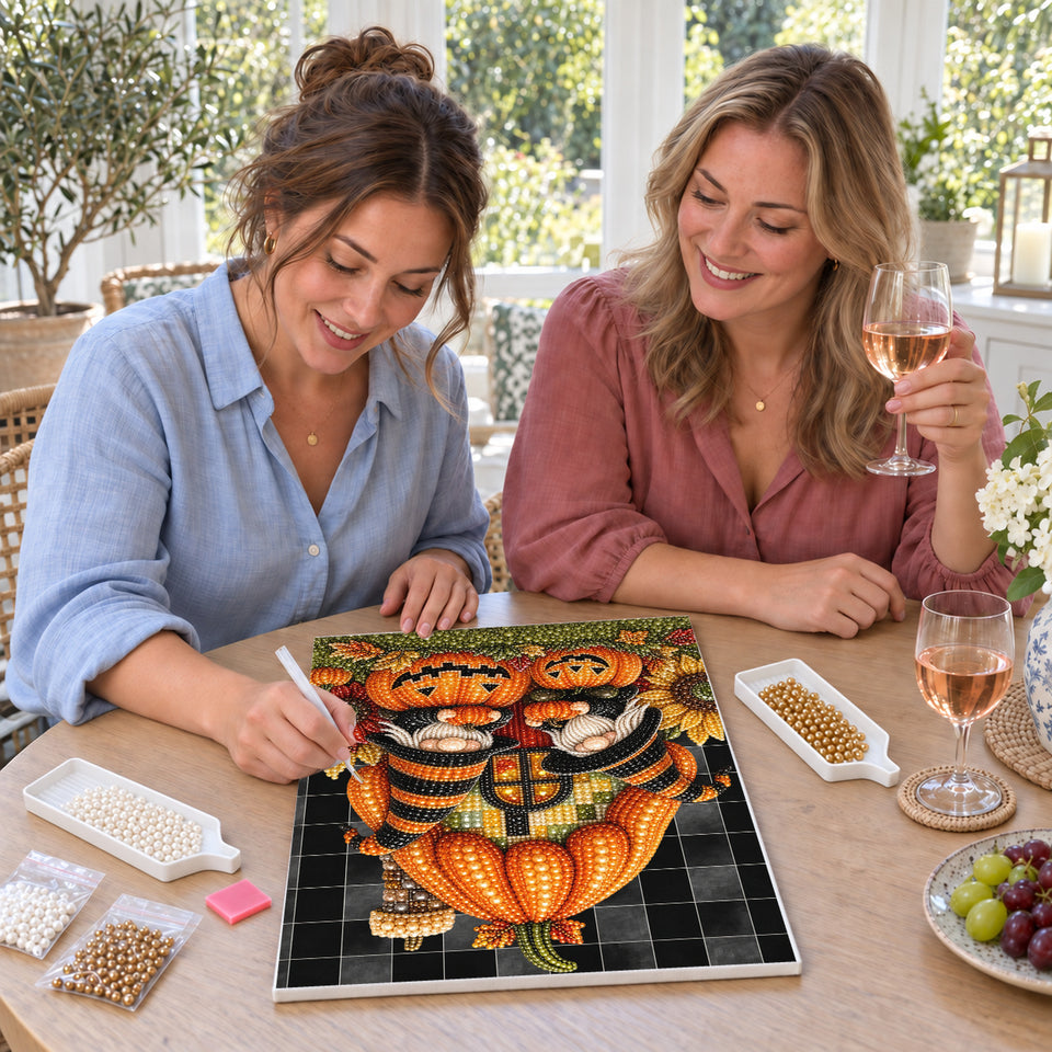 Friends enjoying a sip and craft session — Pumpkin House Halloween Gnomes. Pearl diamond painting DIY kit by Isuvio.