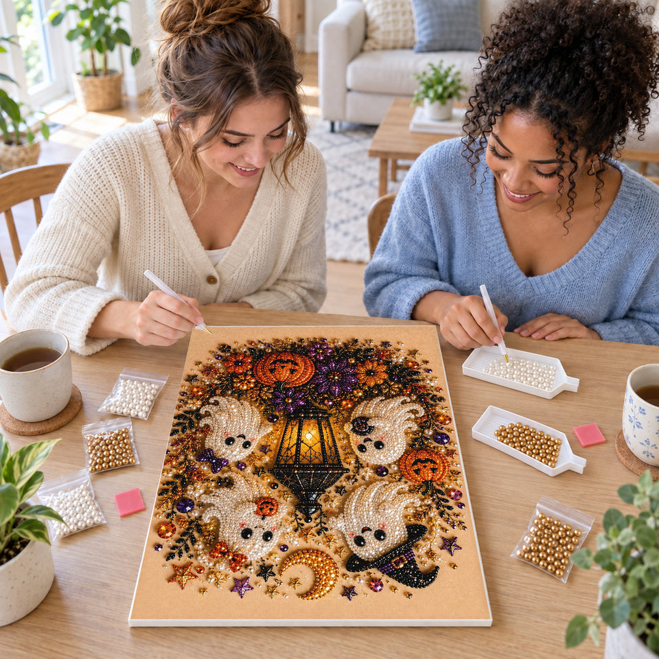 Two friends creating one shared Pearl artwork — Friendly Ghosts Halloween Lantern. Pearl diamond painting DIY kit by Isuvio.