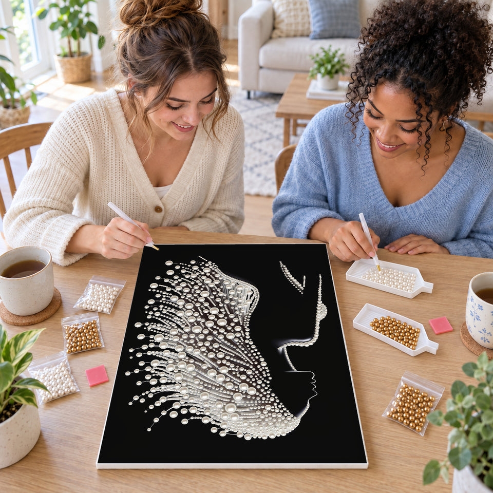 Two friends creating one shared Pearl artwork — Woman in Profile with Flowing White Pearl Hair. Pearl diamond painting DIY kit by Isuvio.