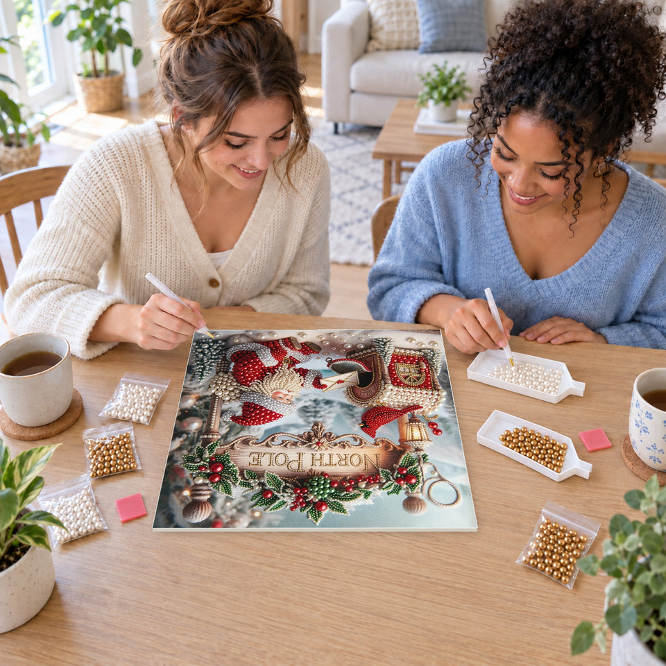 Two friends creating one shared Pearl artwork — Santa at the North Pole Mailbox. Pearl diamond painting DIY kit by Isuvio.