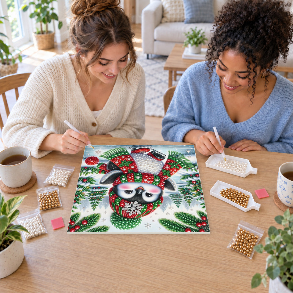Two friends creating one shared Pearl artwork — Ice-Skating Penguin in Red Boots. Pearl diamond painting DIY kit by Isuvio.