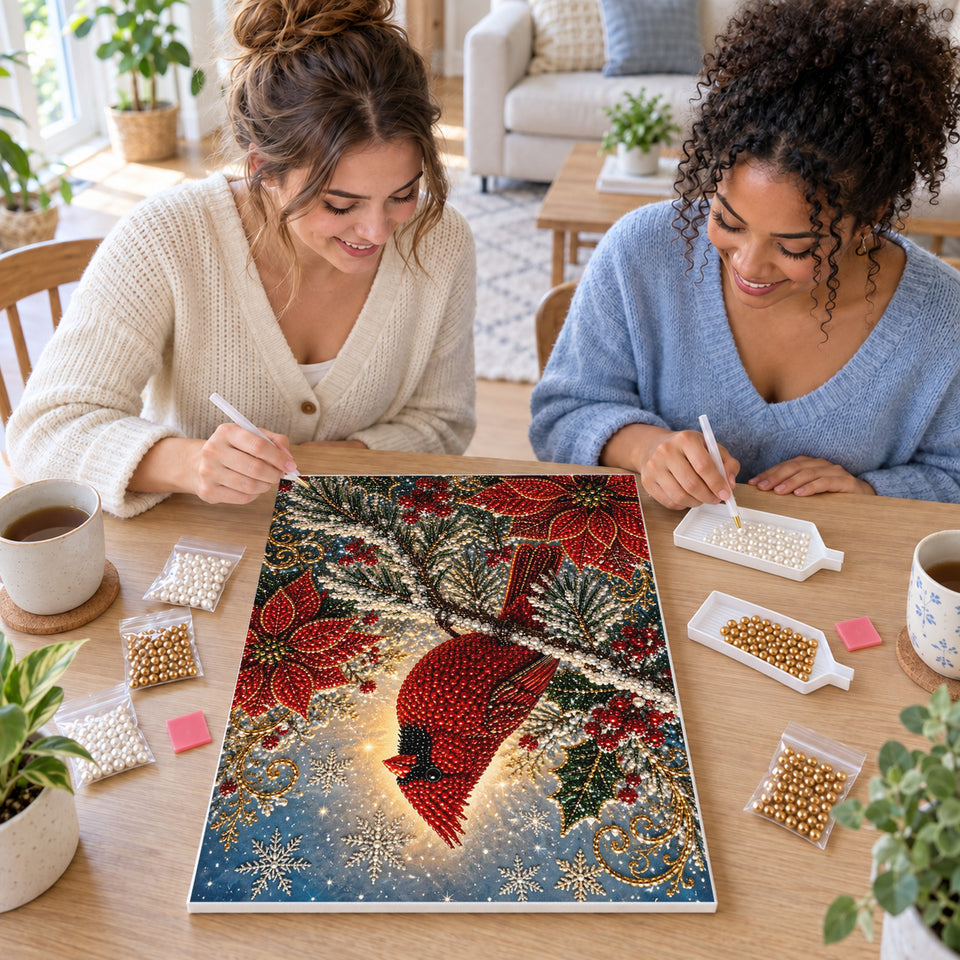 Two friends creating one shared Pearl artwork — Red Cardinal Among Poinsettias and Snowy Branches. Pearl diamond painting DIY kit by Isuvio.
