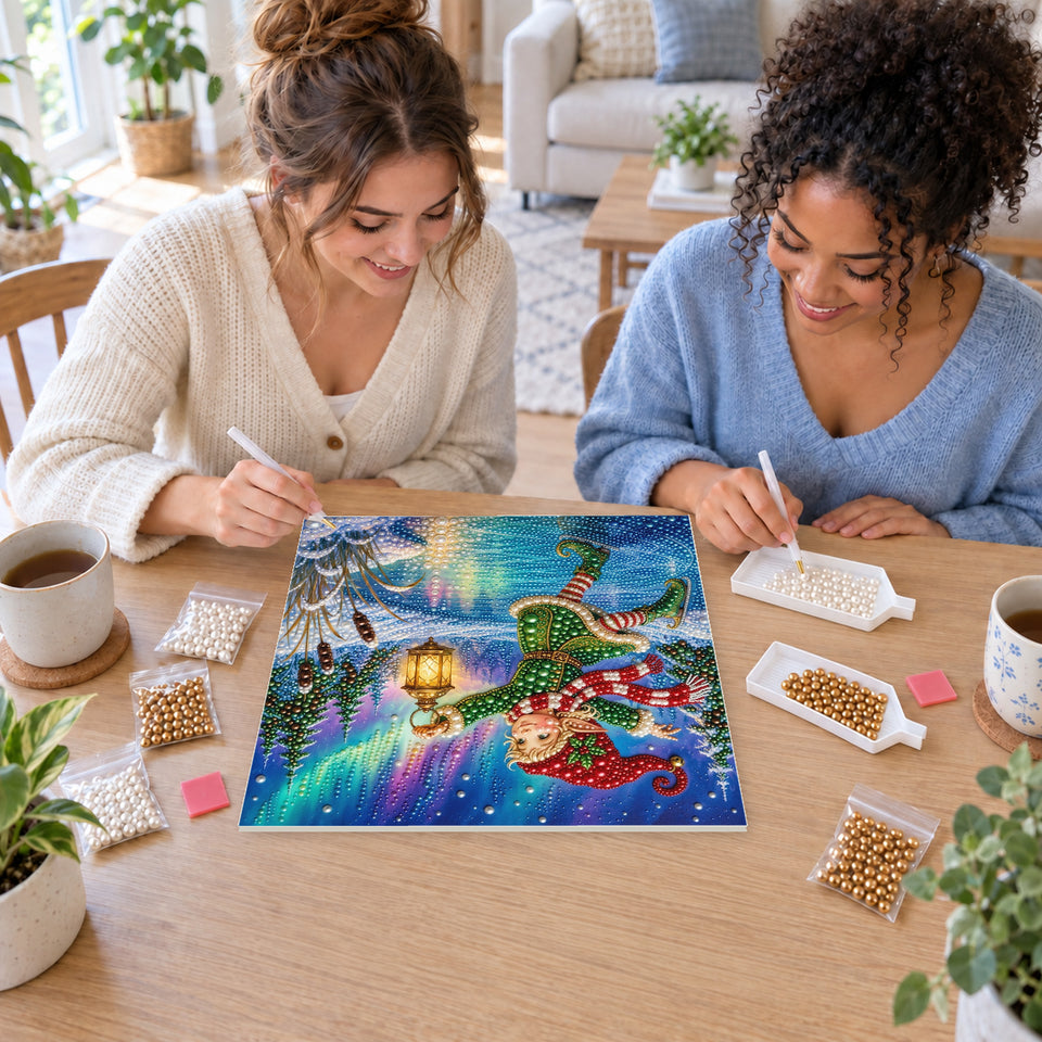 Two friends creating one shared Pearl artwork — Ice-Skating Elf with a Glowing Lantern. Pearl diamond painting DIY kit by Isuvio.