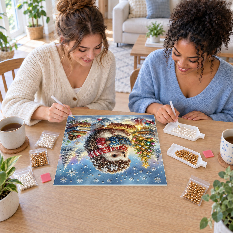 Two friends creating one shared Pearl artwork — Reading Hedgehog on Christmas Books. Pearl diamond painting DIY kit by Isuvio.