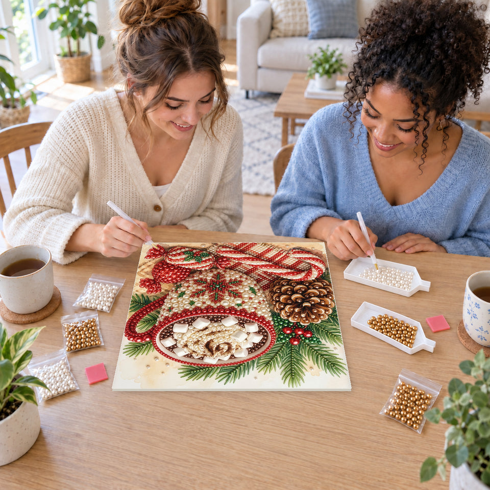 Two friends creating one shared Pearl artwork — Christmas Cocoa in a Knitted Mug. Pearl diamond painting DIY kit by Isuvio.