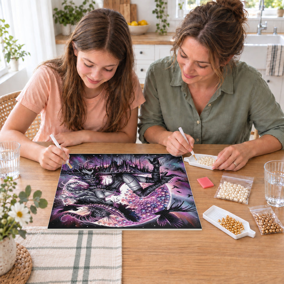Mother and daughter creating one shared Pearl artwork — Silver-Haired Witch with Ravens. Pearl diamond painting DIY kit by Isuvio.