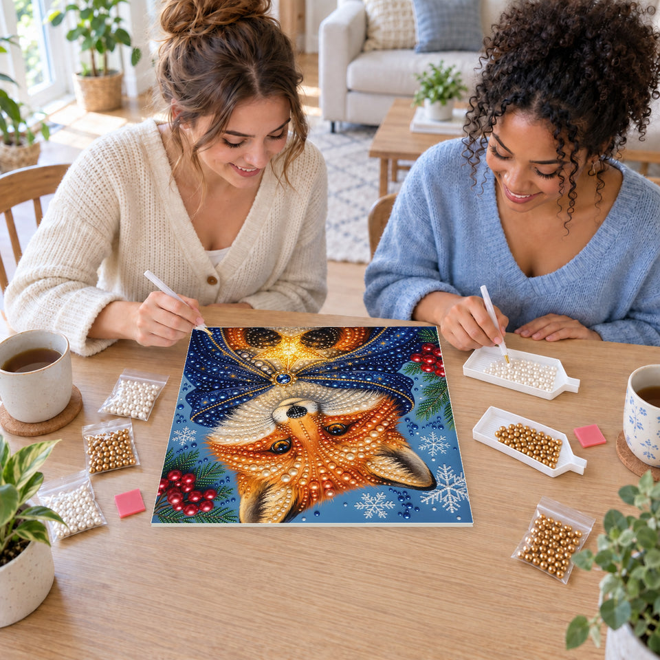 Two friends creating one shared Pearl artwork — Winter Fox in a Blue Cloak with a Golden Star. Pearl diamond painting DIY kit by Isuvio.