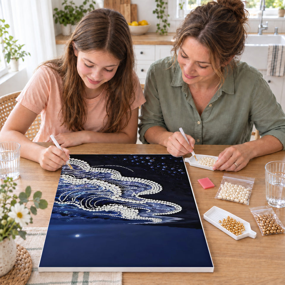Mother and daughter creating one shared Pearl artwork — White Pearl Waves Along a Midnight Shore. Pearl diamond painting DIY kit by Isuvio.