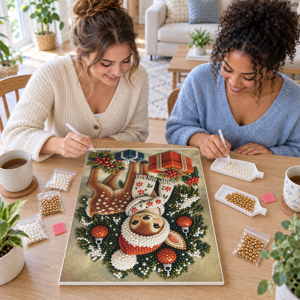 Two friends creating one shared Pearl artwork — Christmas Fawn in a Red Santa Hat. Pearl diamond painting DIY kit by Isuvio.