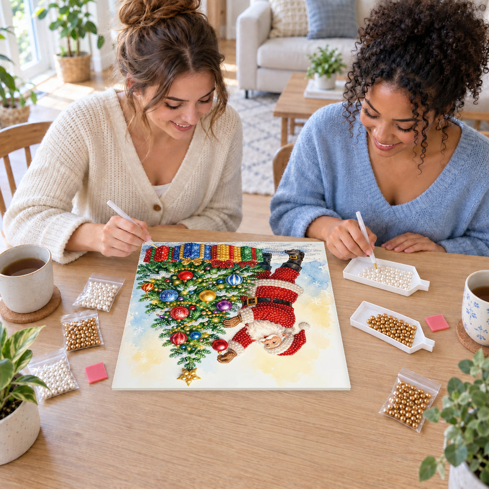 Two friends creating one shared Pearl artwork — Santa Decorating the Christmas Tree. Pearl diamond painting DIY kit by Isuvio.