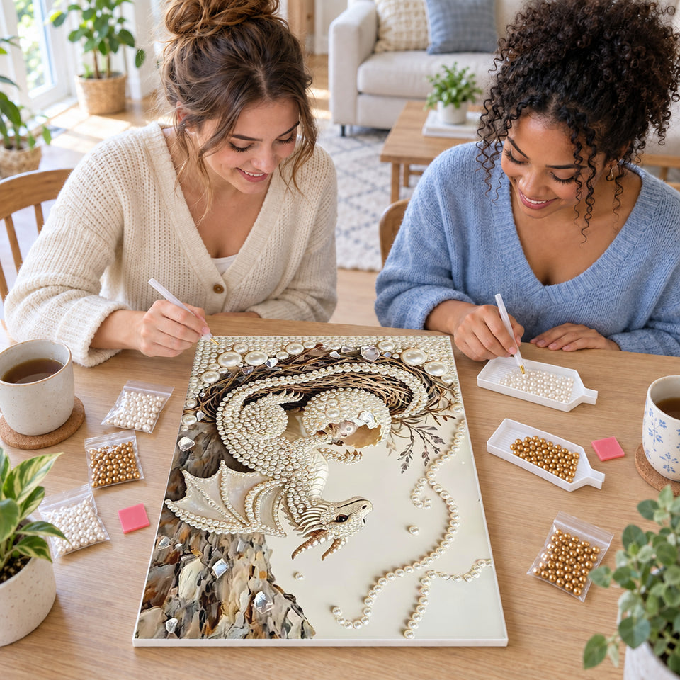 Two friends creating one shared Pearl artwork — White Pearl Dragon Guarding a Nest. Pearl diamond painting DIY kit by Isuvio.