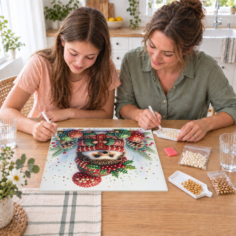 Mother and daughter creating one shared Pearl artwork — Christmas Hedgehog among Colorful Baubles. Pearl diamond painting DIY kit by Isuvio.
