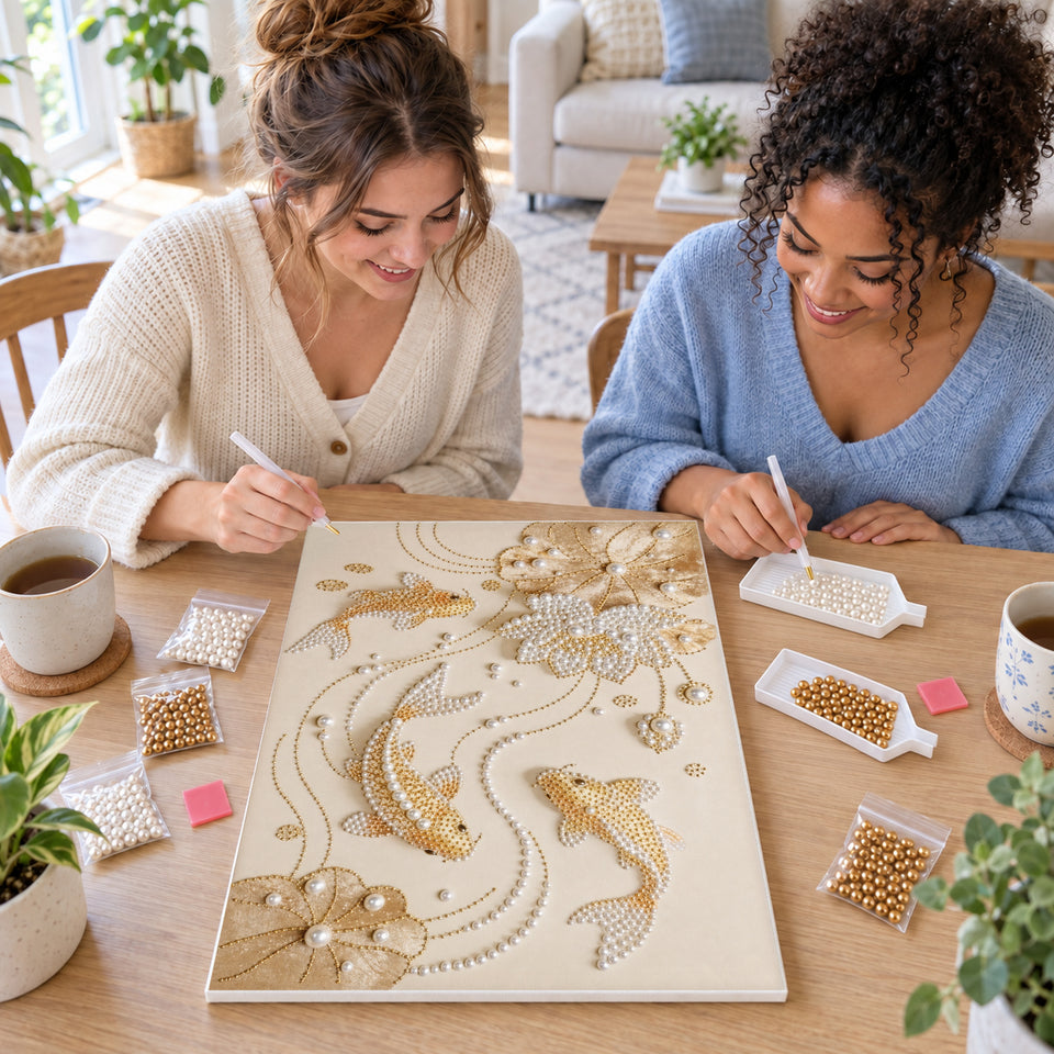 Two friends creating one shared Pearl artwork — Golden Koi and Pearl Lotus. Pearl diamond painting DIY kit by Isuvio.